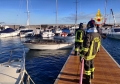 Incendio nel porto marinese, fotocronaca dello spegnimento